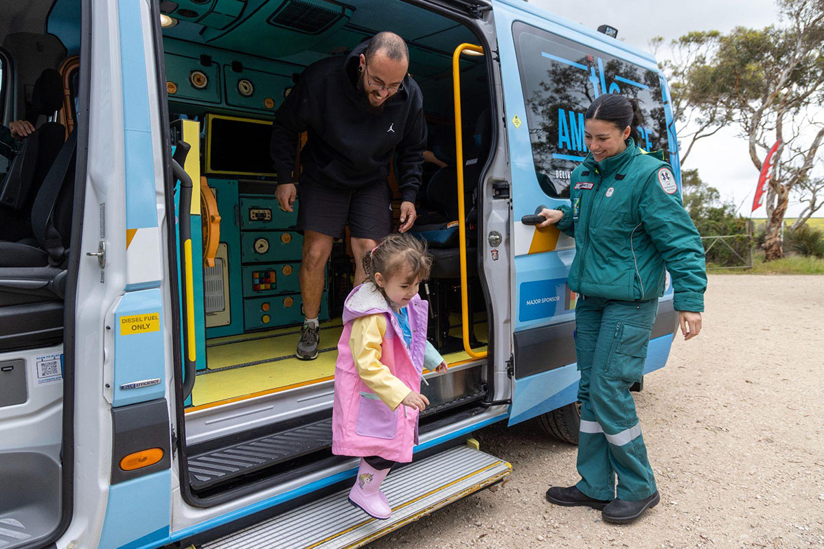 Variety Community Grant showing TLC kids ambulance with ambulance staff